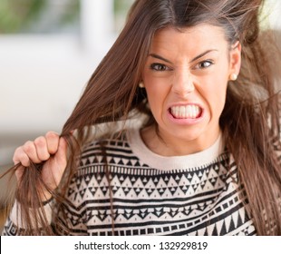 Portrait Of Frustrated And Angry Woman Pulling Her Hair
