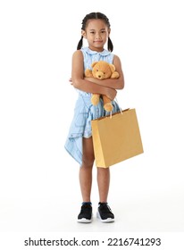 Portrait Full Body Studio Cutout Shot Asian Young Pigtail Braid Hair Shopper Girl In Blue Dress Standing Smiling Holding Brown Bear Doll And Paper Shopping Bag Look At Camera On White Background