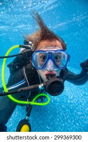 Portrait Of Full Equiped Diver In Swimming Pool