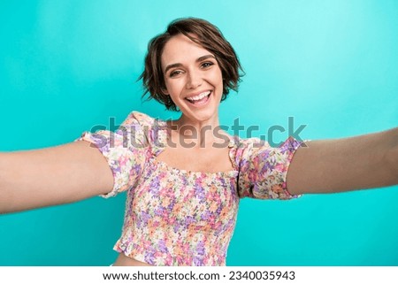 Portrait of funky cheerful girl toothy smile take selfie blogging record video isolated on turquoise color background