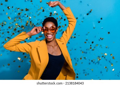 Portrait of funky crazy lady arm touch glasses clubbing fly star confetti isolated on blue color background - Powered by Shutterstock