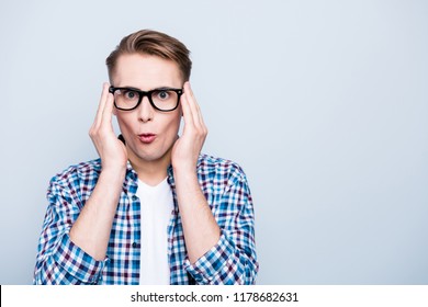 Portrait Of Funky, High, School, Teenager Correct Glasses By Hands Look At Camera Stand Isolated On Light Gray Background With Copy Space For Text In Blue Checkered Shirt And White T-shirt