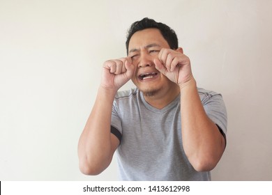 Portrait Of Funny Asian Man Crying Close His Eyes, Sad Depression Frustration Hopeless Expression