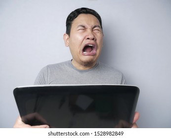 Portrait Of Funny Asian Man Crying Hard, Sad Depression Frustration Hopeless Expression, Find Bad News On Internet