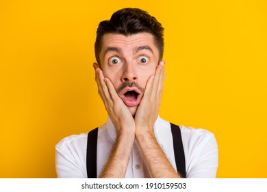 Portrait Of Funny Attractive Worried Guy Wearing White Shirt Unexpected News Reaction Isolated Over Bright Yellow Color Background