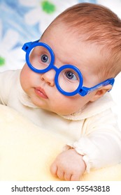 Portrait Of Funny Baby With Glasses