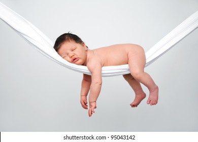Portrait of funny baby relaxing in hammock - Powered by Shutterstock