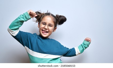 Portrait of funny brunette little girl fooling around rejoicing isolated on white background - Powered by Shutterstock