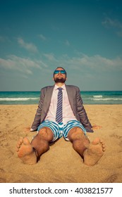 Portrait Of Funny Businessman On The Beach. Man Having Fun By The Sea. Summer Vacation And Travel Concept