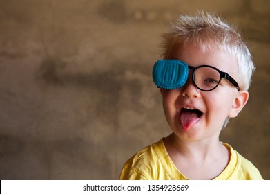 Portrait Of Funny Child In New Glasses With Patch For Correcting Squint 
Ortopad Boys Eye Patches Nozzle For Glasses For Treatment Of Strabismus (lazy Eye)