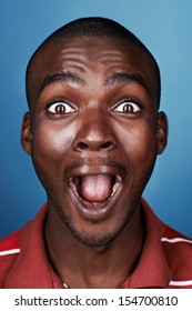portrait of funny face real african man screaming face