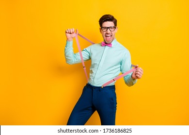 Portrait Of Funny Funky Crazy Guy Pull His Suspenders Feel Candid Face Expression Shout Wear Good Look Outfit Isolated Over Shine Color Background