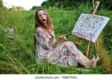 Portrait Of A Funny Girl Making Weird Facial Expressions While Painting On The Meadow.