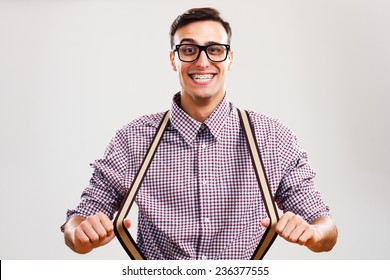 Portrait Of Funny Handsome Nerd Guy Pulling His Suspenders.I Am So Handsome!