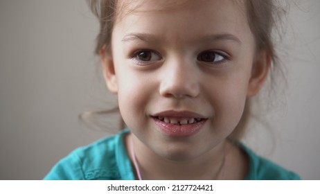 Portrait Funny Happy Little Kid Close Up Happy Preschool Girl Smiling Child Looking At Camera Pretty Natural Face. Sincere Emotions Ashamed, Embarrassed Clean Skin Dermatology, Pediatric Dentistry