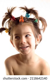 Portrait Of Funny Little Boy Or Girl Looking Off Camera With Wild Hair On White Background.