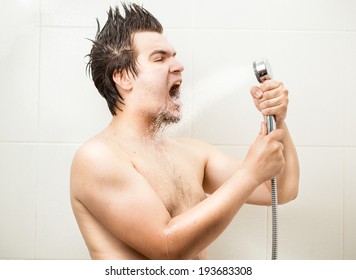 Portrait Of Funny Man Singing At Shower