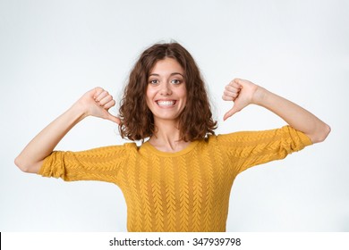 Portrait of a funny smiling woman pointing fingers on herself isolated on a white background
