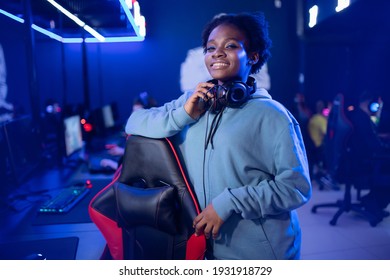 Portrait Gamer African American Beautiful Woman Play Online Games Computer, Streamer Neon Room.