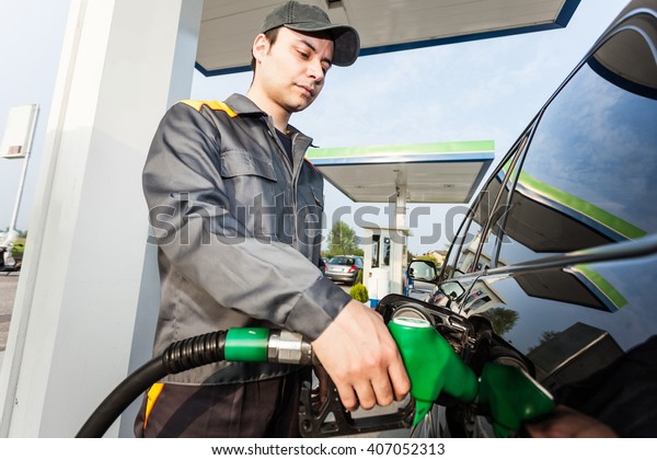 Portrait of a gas station\
worker