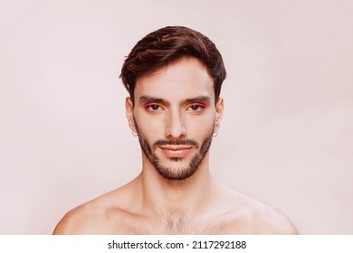 Portrait Of Gay Man With Beard, Pink And Yellow Eyeshadow, No Clothes. Beauty, Make-up And Skin Care Concept. Studio Face Shot, Copy Space.