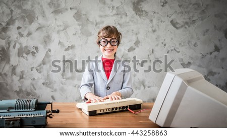 Portrait of geek child pretend to be businessman. Funny kid in vintage loft office. Success, creative and innovation technology concept. Copy space for your text