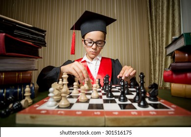 Portrait Of Genius Girl In Graduation Cap Playing Chess With Herself