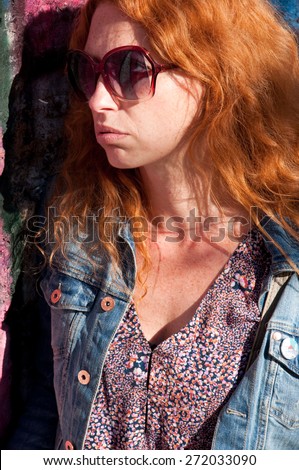 portrait of ginger woman with cynical face 