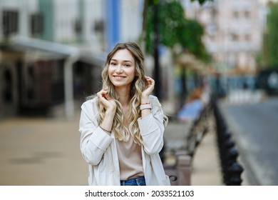 portrait of a girl against the background of a blurred city
