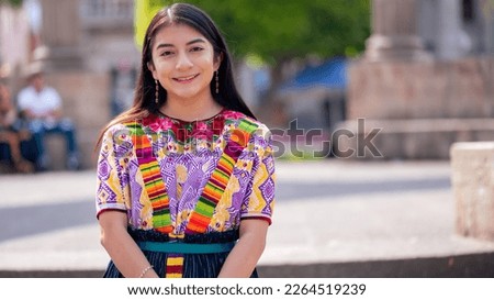 Portrait of a girl against a background of neoclassical architecture.