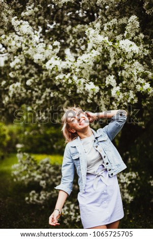 Similar – Woman with sunglasses touching over nature background