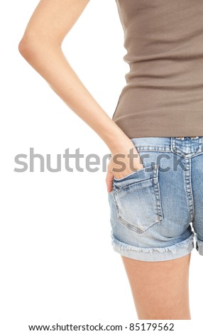 portrait of girl from back in trousers, jeans shorts, with brown casual shirt, series