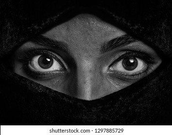 Portrait of a girl with big eyes wearing a burka, black and white photo - Shutterstock ID 1297885729