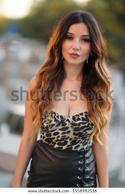 black leather skirt leopard print shirt