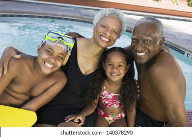 Portrait of a girl and boy with grandparents by the swimming pool - Powered by Shutterstock