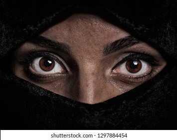 Portrait of a girl with brown eyes carries a burka - Shutterstock ID 1297884454