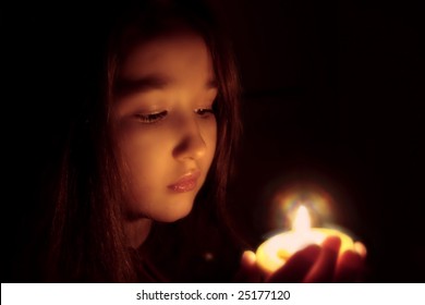 Portrait Of The Girl With A Candle In Hands. The Spirituality Face . Mood Of Sacrament And Revelation.