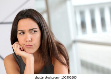 Portrait Of Girl With Doubtful Look On Her Face