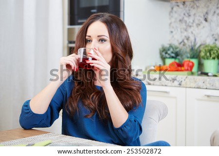 Portrait of a girl eating breakfast in an apartment