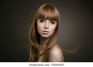 portrait of girl with flying hair, hair products, sleek hair in motion - Shutterstock ID 570293107