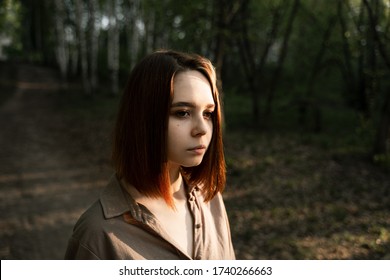 portrait of a girl in the forest with brown hair