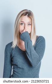 Portrait Of A Girl Holding Her Nose