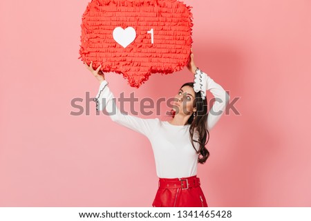 Portrait of girl with interest looking at huge 