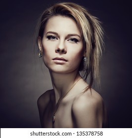 Portrait Of A Girl With Jewelry And Piercing Eyes