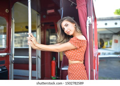 portrait of girl with light red blouse and skirt in the bus - Shutterstock ID 1502782589