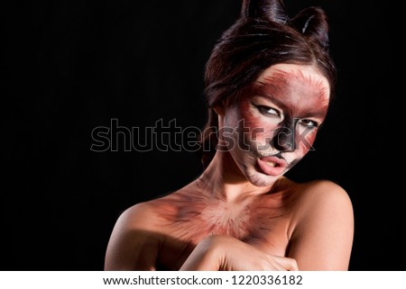 Portrait of a girl makeup and makeup cats