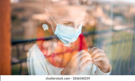 Portrait Of A Girl In A Mask Outside The Window, Showing With Her Hands In Sign Language.