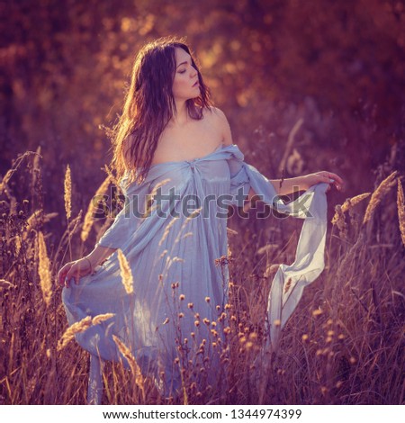 Similar – Woman posing in field of white flowers