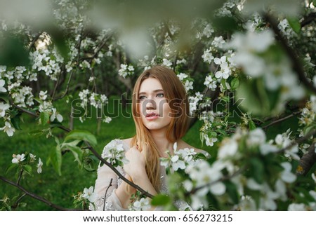 Similar – Woman posing in field of white flowers