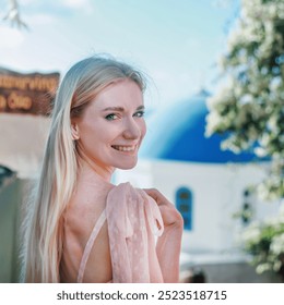 Portrait of girl in pink dress walks through the narrow streets of Santorini, Greece, Europe - Powered by Shutterstock